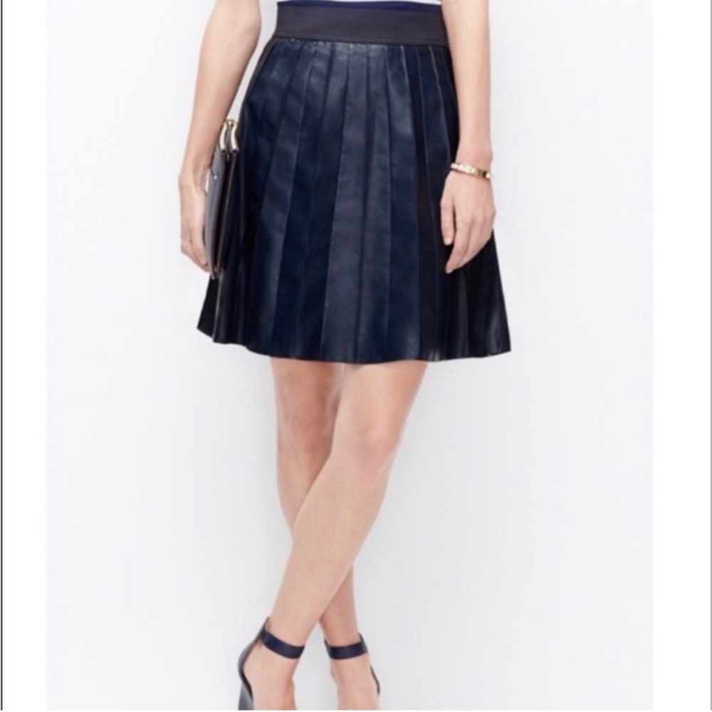 Ann Taylor Faux Leather skirt with pleats and side zipper enclosure. Fully lined